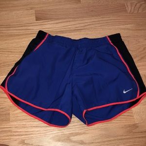 NIKE running shorts in blue with red outline